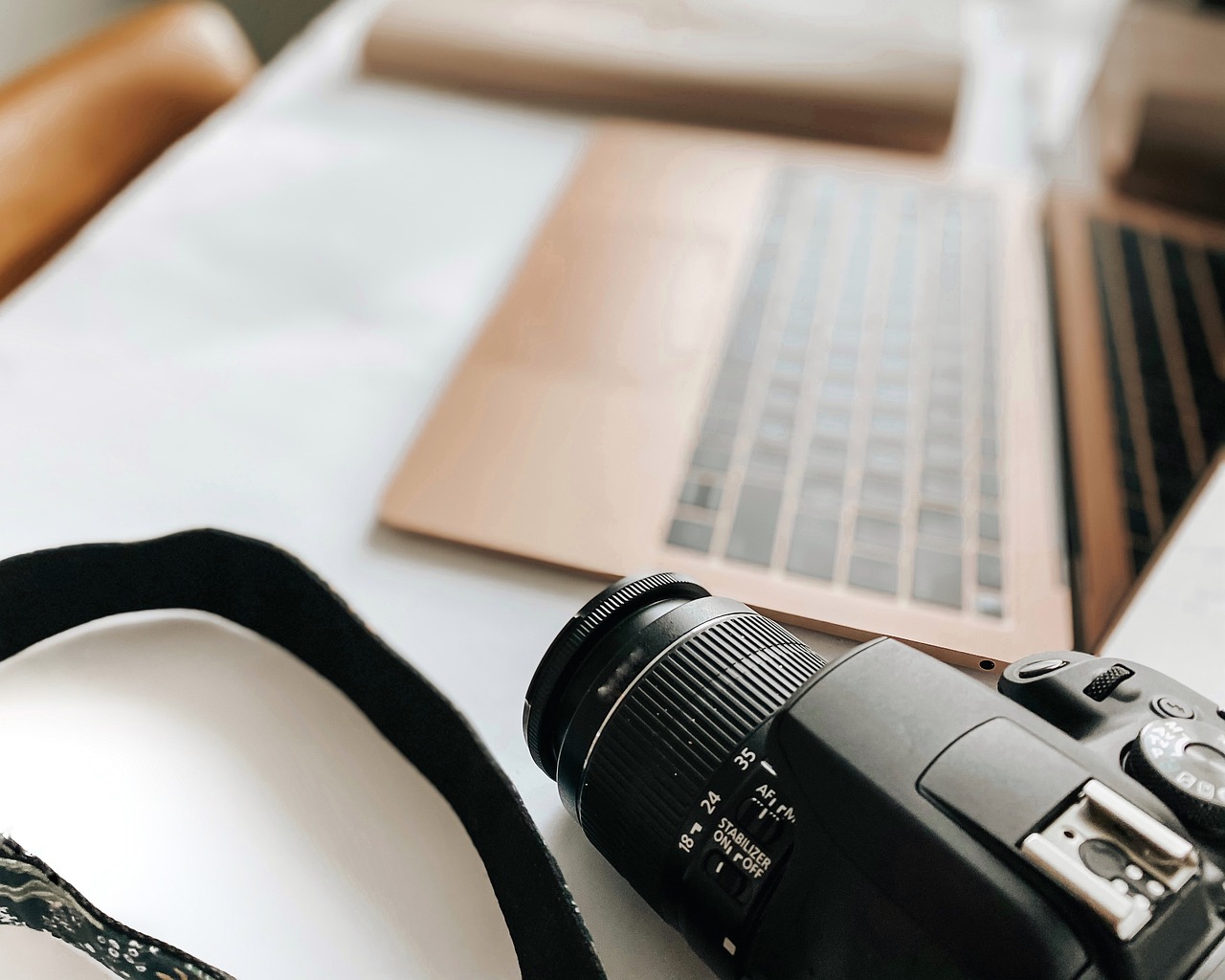 a camera sitting on top of a table next to a laptop, a picture, art photography, close - up studio photo, high quality product photo, soft lighting and focus, high detailed photography cape