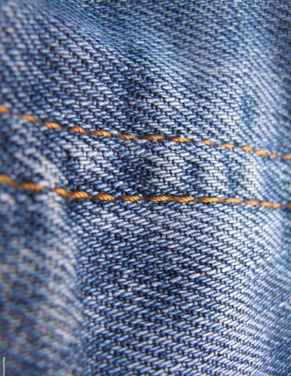 a close up of a pair of blue jeans, a macro photograph, pexels, lined in cotton, shot on kodak vision 200t, golden thread, rust