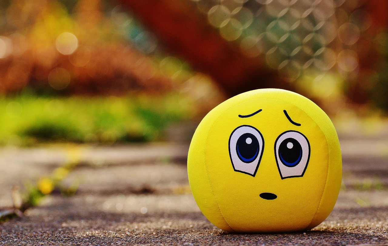 a yellow ball with a face drawn on it, a picture, trending on pixabay, looks sad and solemn, 4 k hd wallpapear, round cute face, cute toy