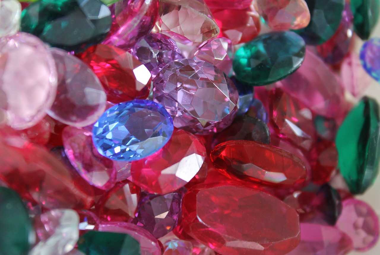 a close up of a bunch of different colored gems, a portrait, by Leonard Bahr, pexels, - h 1 0 2 4, magenta and crimson and cyan, sapphire, ( ready - made )