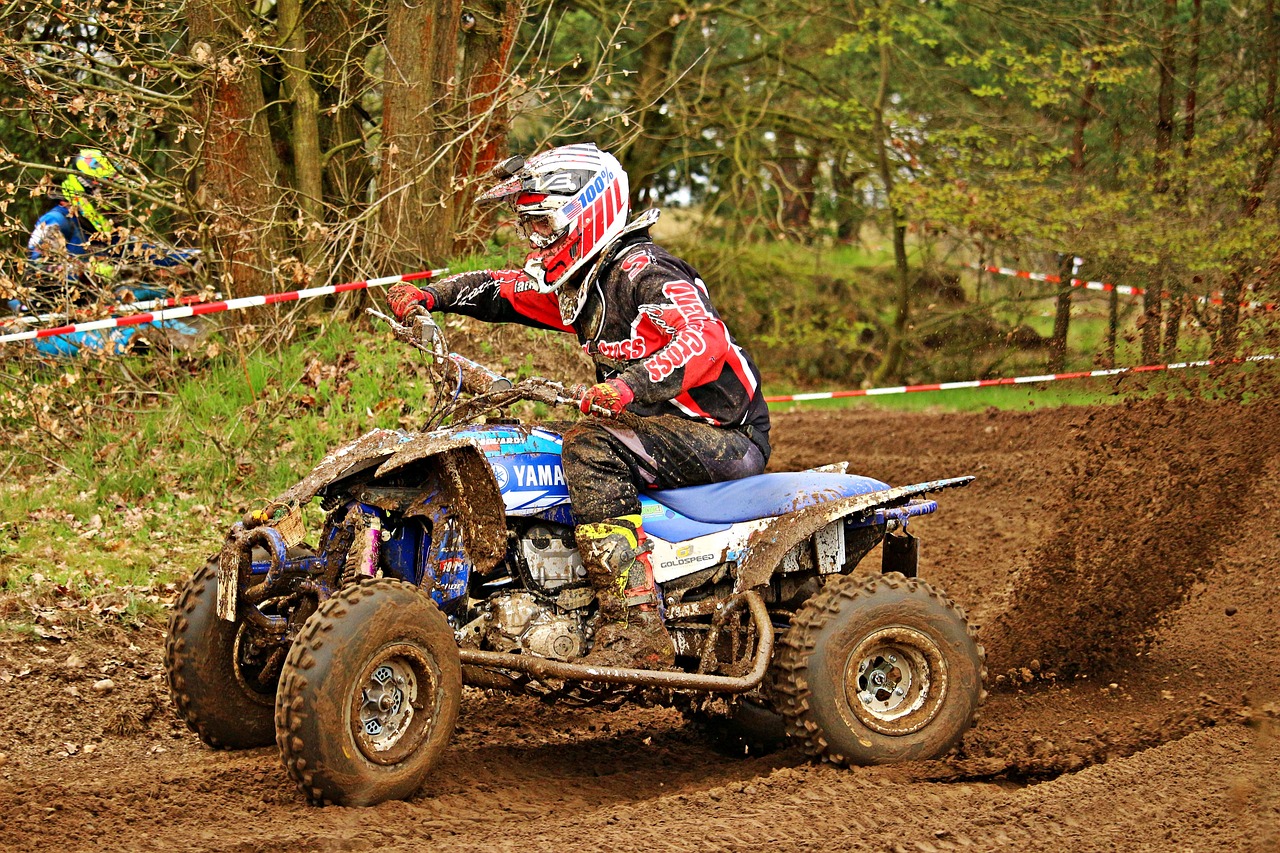 a man riding on the back of a dirt bike, a photo, by Julian Allen, flickr, all terrain vehicle race, stathmore 4 0 0, vixen, proud looking
