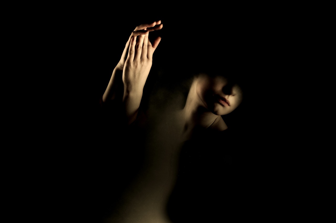 a close up of a person holding a cell phone, a portrait, by Maciej Kuciara, figuration libre, emanating magic from her palms, dark scene with dim light, sandman, woman silhouette