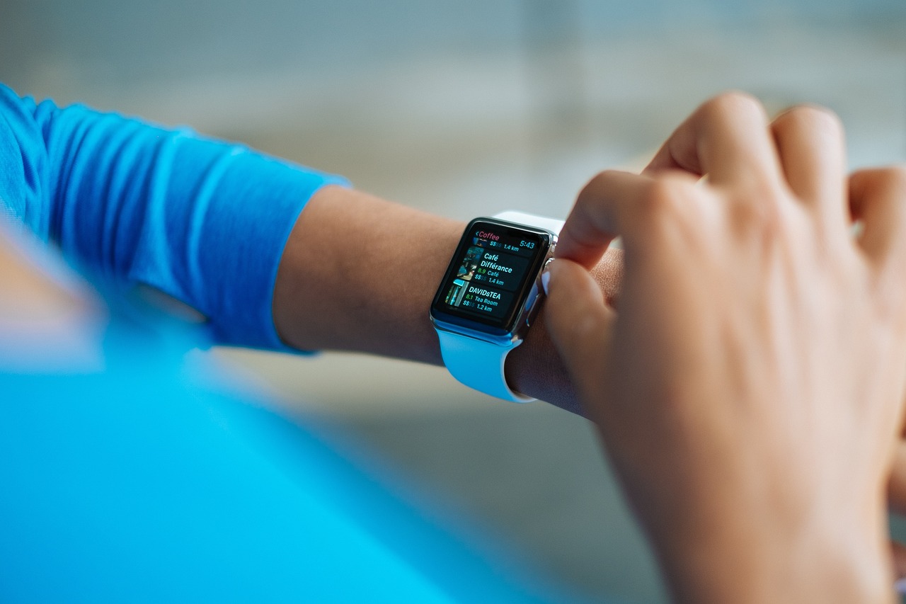 a close up of a person holding an apple watch, a picture, happening, 3 dimensional, functional, overlooking, shaded