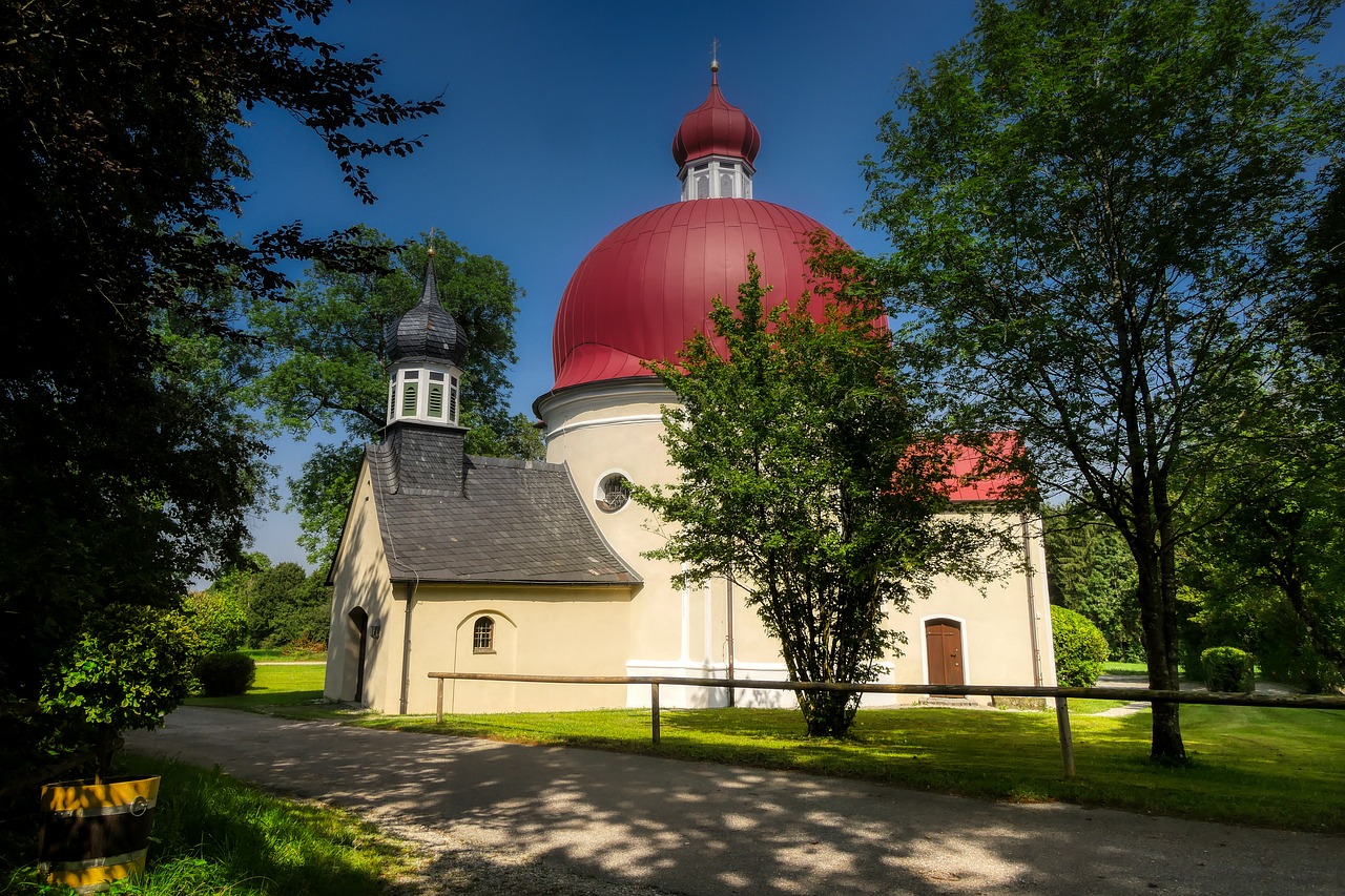 a church with a red dome surrounded by trees, by Jan Henryk Rosen, shutterstock, baroque, rounded roof, shady, munkácsy, fan favorite