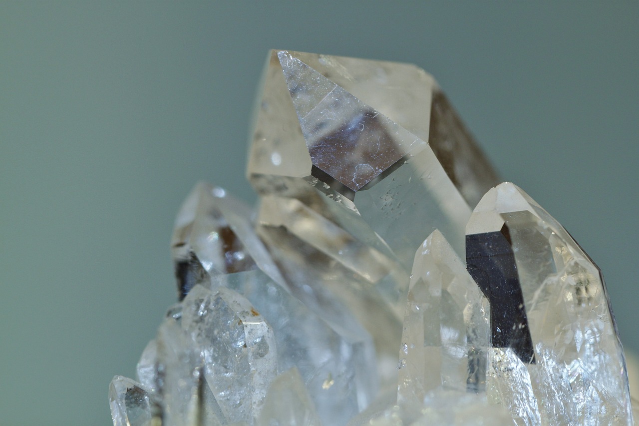 a cluster of crystals sitting on top of a table, a macro photograph, by Karel Štěch, close-up product photo, ashe, full image