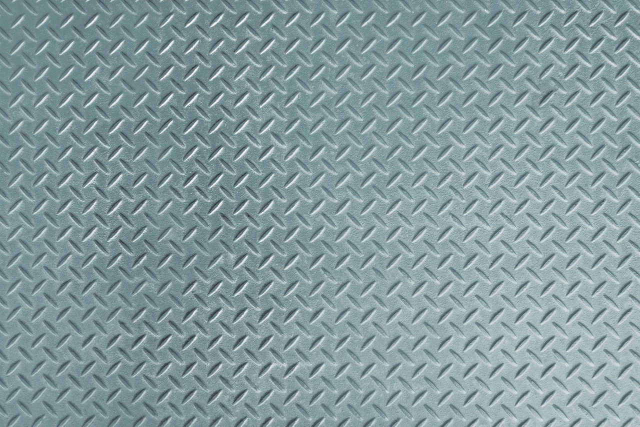 a close up of a metal surface with a diamond pattern, by Jan Kupecký, art deco, pastel blue, textured base ; product photos, metal floor, rubi