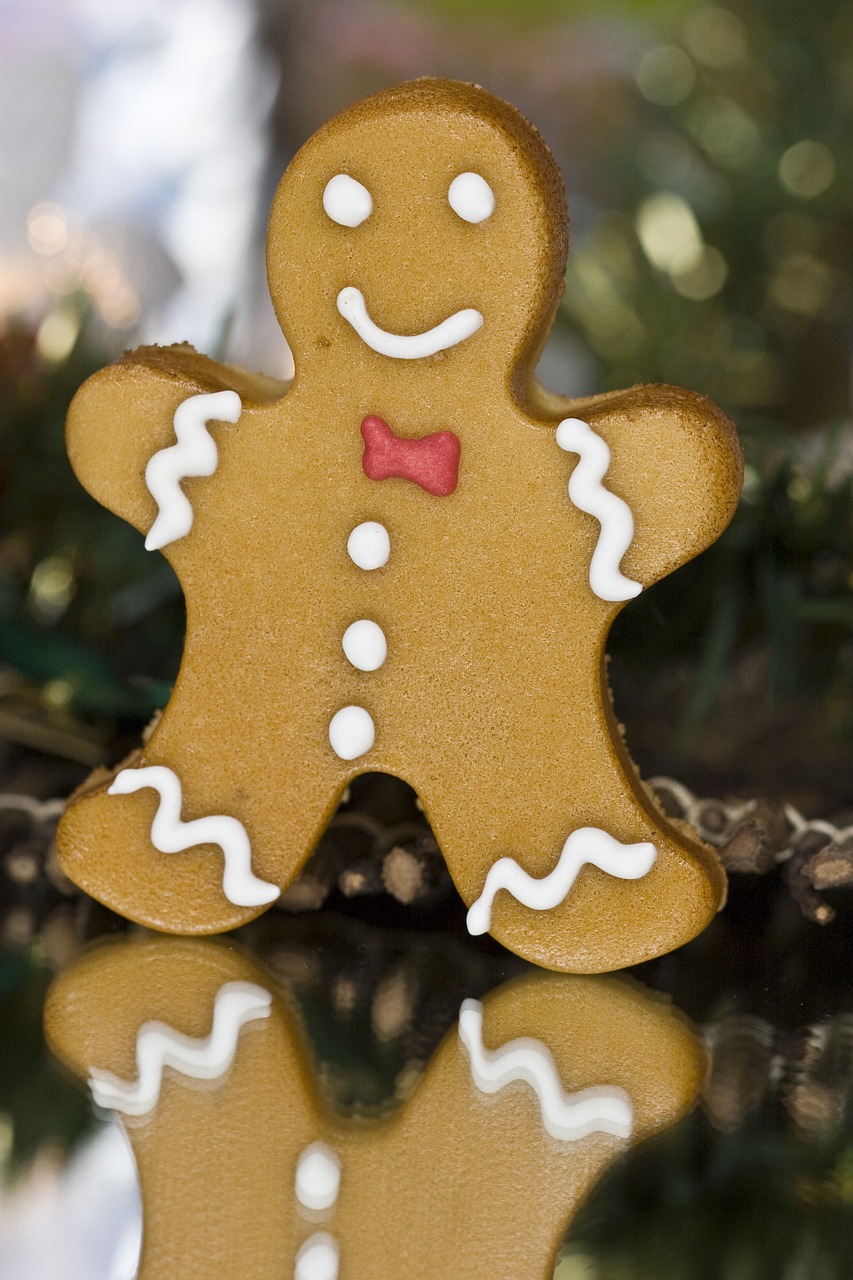 a close up of a cookie on a table, folk art, istockphoto, gingerbread people, handsome man, closeup - view