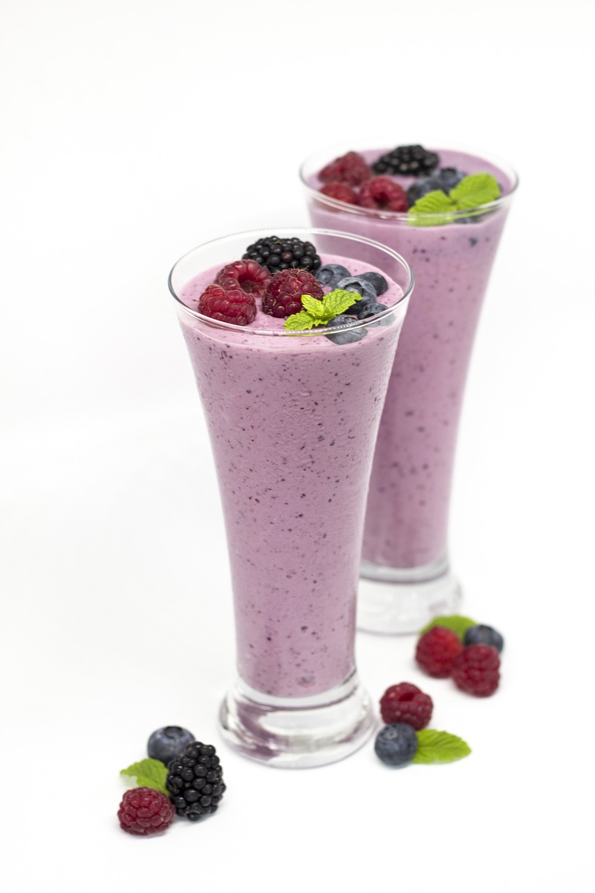 two glasses of smoothie with berries and mint leaves, by Randy Post, renaissance, istockphoto, creamy skin, ham, purple liquid