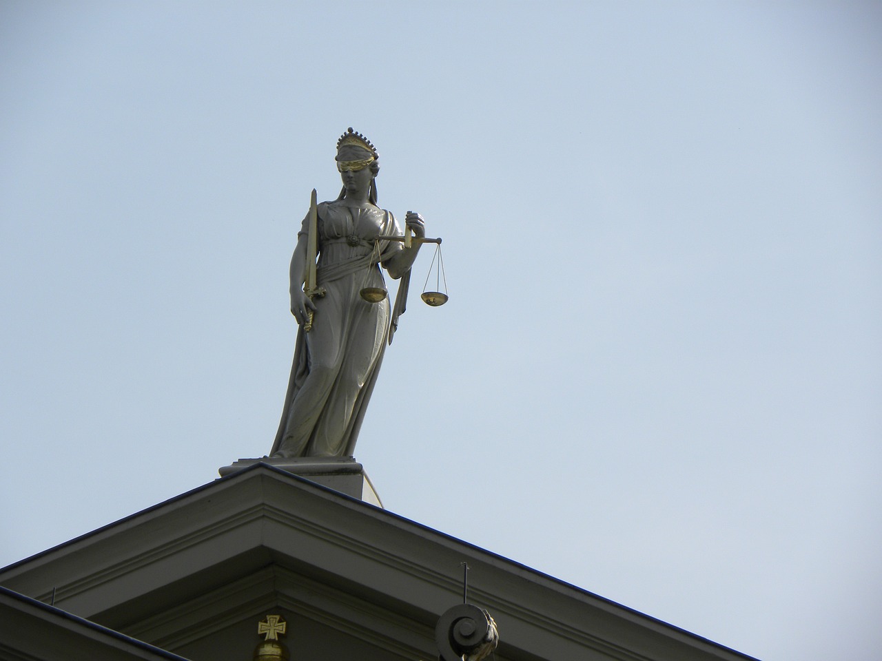 a statue of a lady justice on top of a building, a statue, by Andrei Kolkoutine, shutterstock, figuration libre, high shadow, helsinki, high details photo, set photo