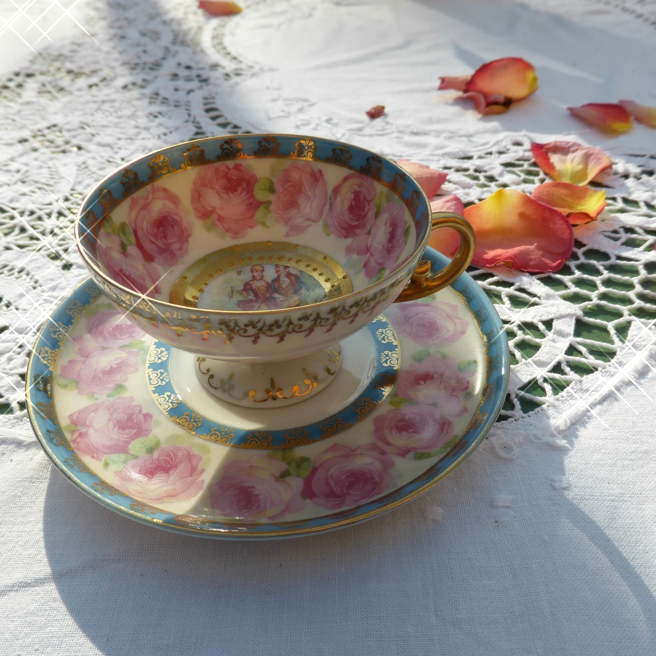 a close up of a cup and saucer on a table, a pastel, inspired by Margaret Brundage, flickr, art nouveau, sitting in the rose garden, sparkling in the sunlight, fully decorated, ayami