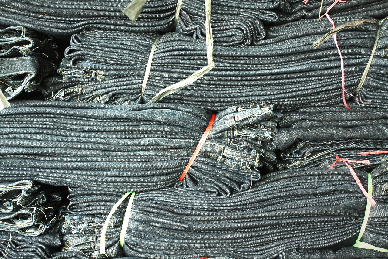 a pile of black jeans sitting on top of each other, a stock photo, by Joy Garnett, renaissance, in warehouse, sichuan, hdpe, very detailed picture