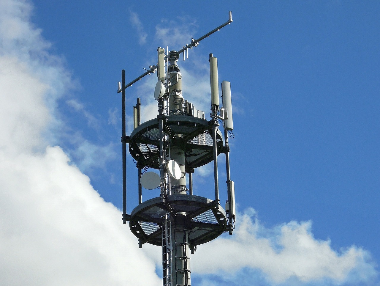 a cell phone tower with a blue sky in the background, shutterstock, wikimedia commons, radiolaria, top - side view, in 2 0 1 5