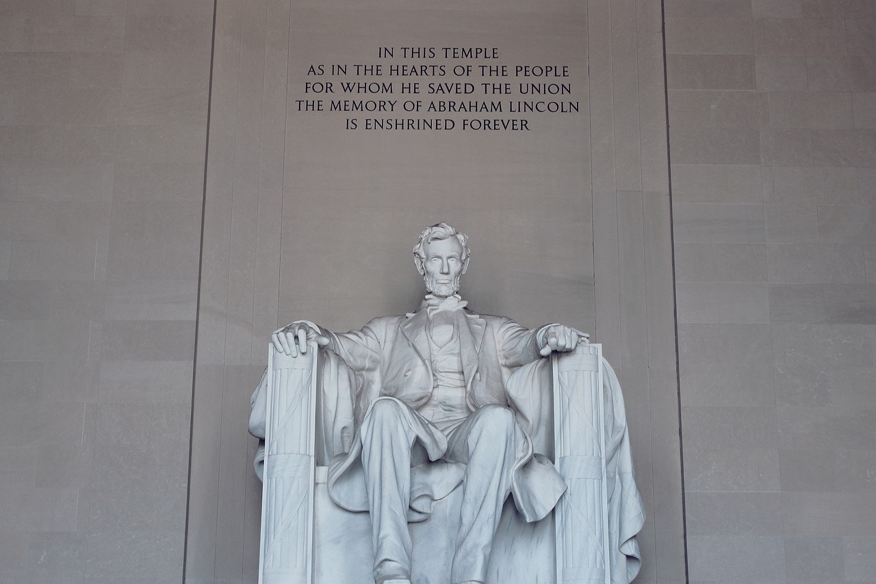 a statue of abraham lincoln at the lincoln memorial, pexels, sitting on a stone throne, half image, handwritten, door