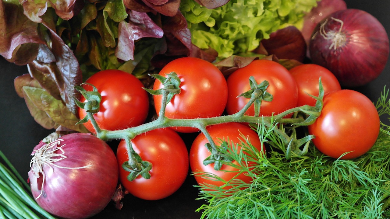 a bunch of tomatoes sitting on top of a table, by Stefan Gierowski, pixabay, surrounding onions, greens, vertical orientation, istockphoto