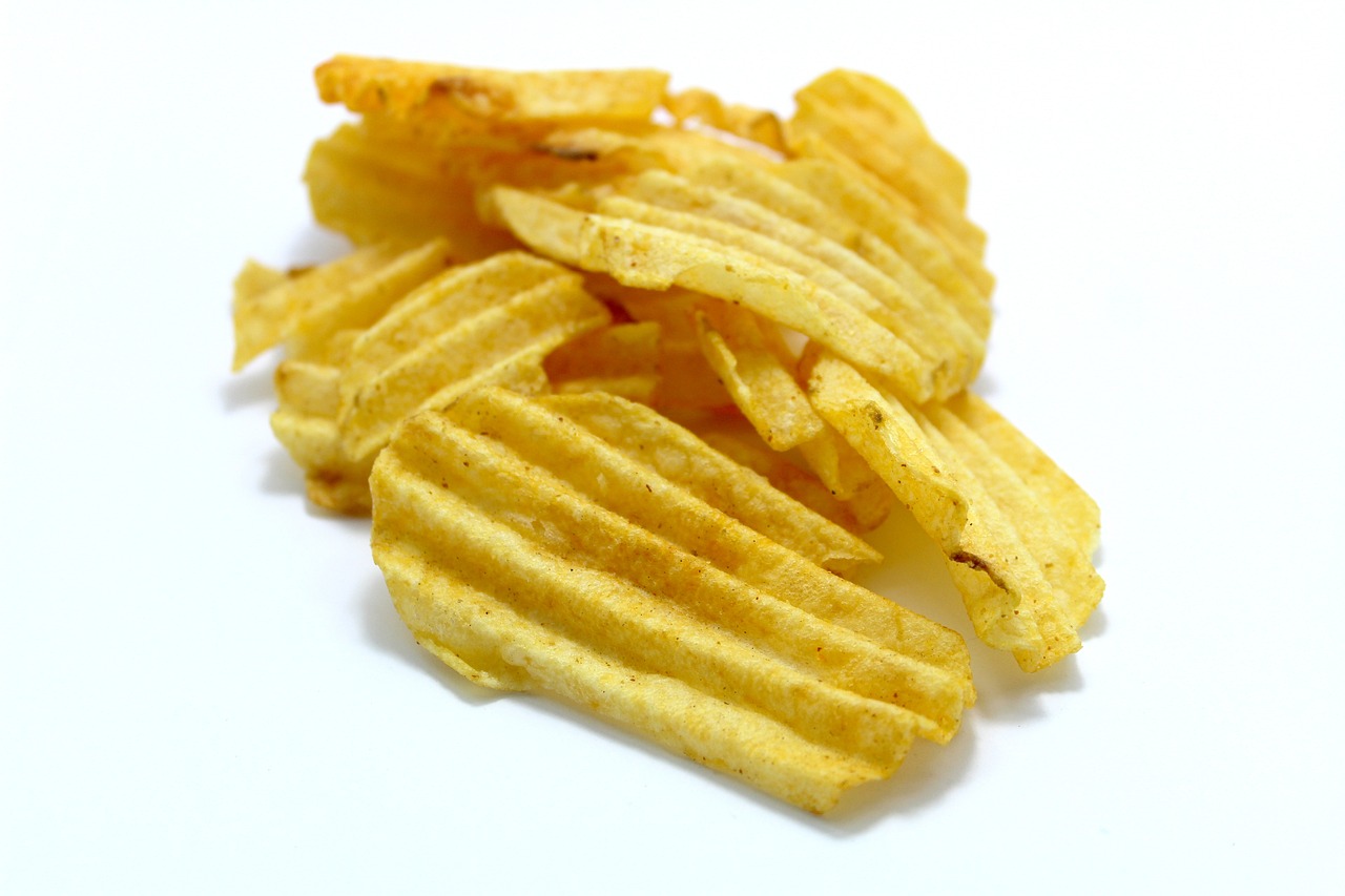 a pile of potato chips on a white surface, a picture, renaissance, stripes, product introduction photo, crisp hd image, food blog photo