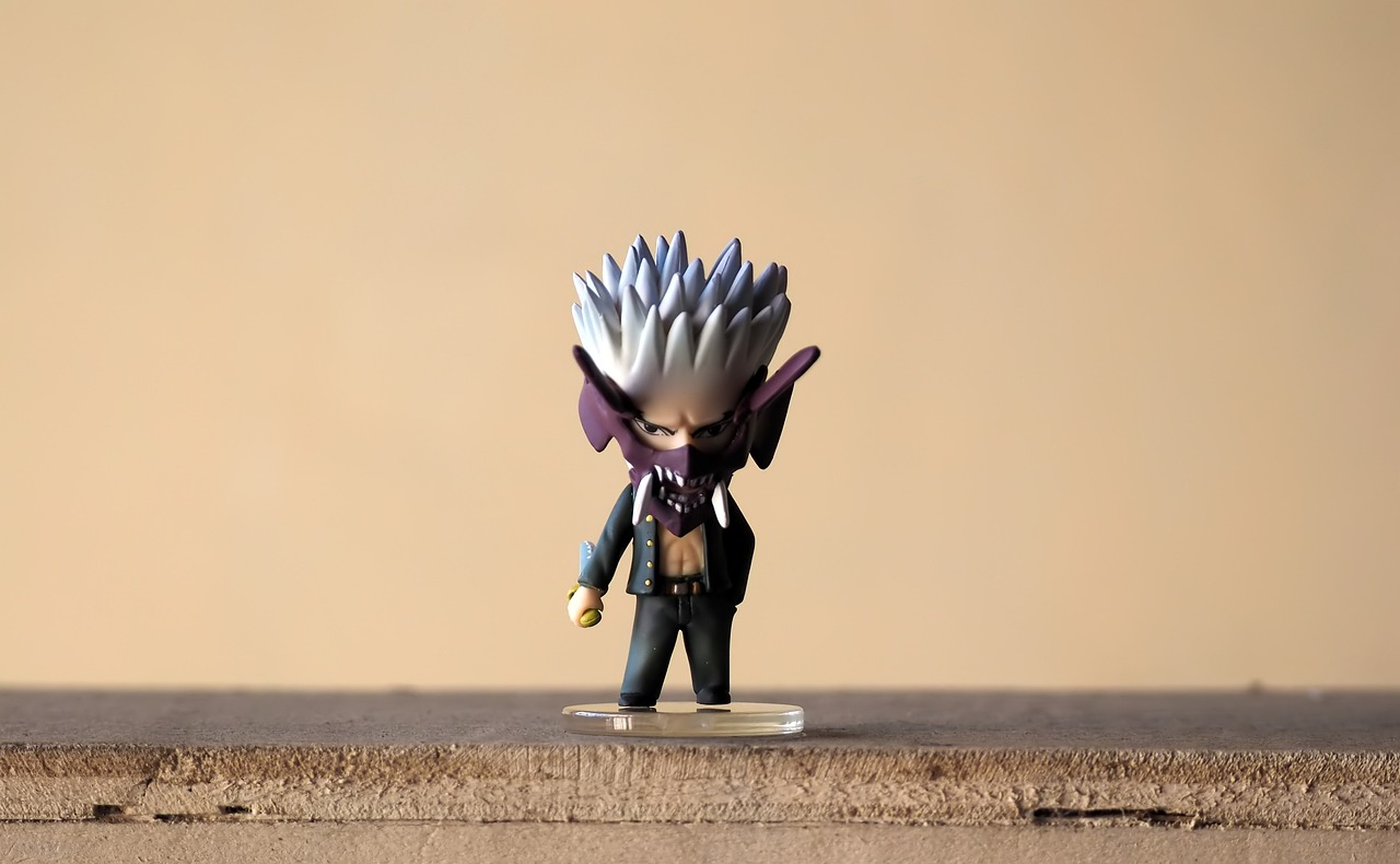 a close up of a toy figure on a table, inspired by Kamisaka Sekka, vanitas, fox from league of legends chibi, gray haired, a humanoid thistle monster, wolverine action pose