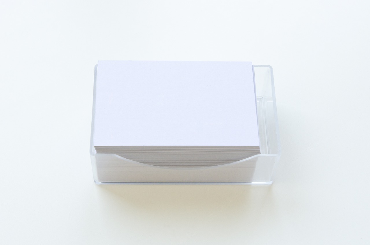 a stack of white cards sitting on top of a table, a picture, smooth transparent visor, 5 5 mm photo, japanese, white box