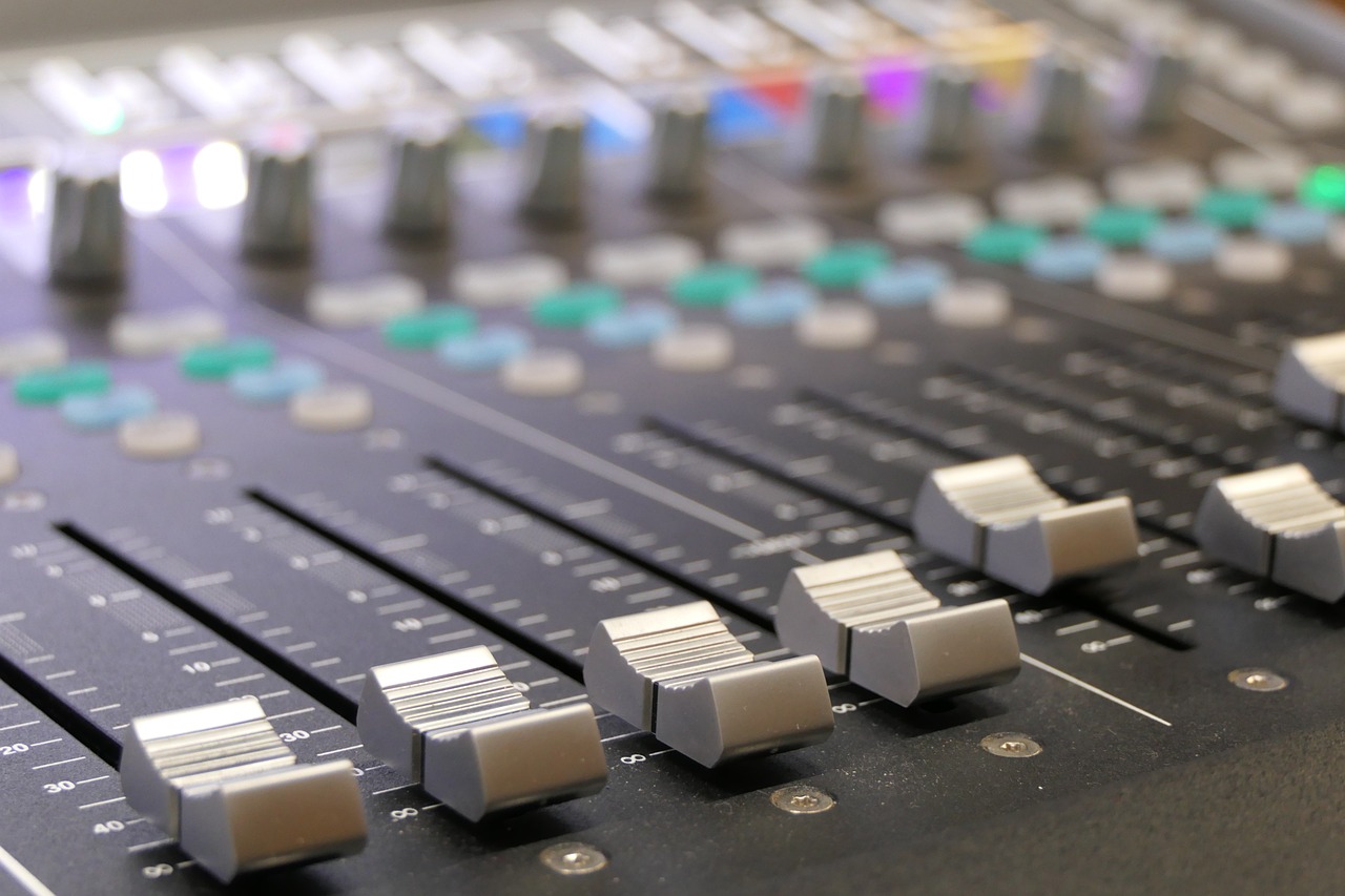 a close up of a sound board in a recording studio, by Alison Watt, shutterstock, micro detail 4k, 🎨🖌️, sports broadcast, tuned to a dead channel