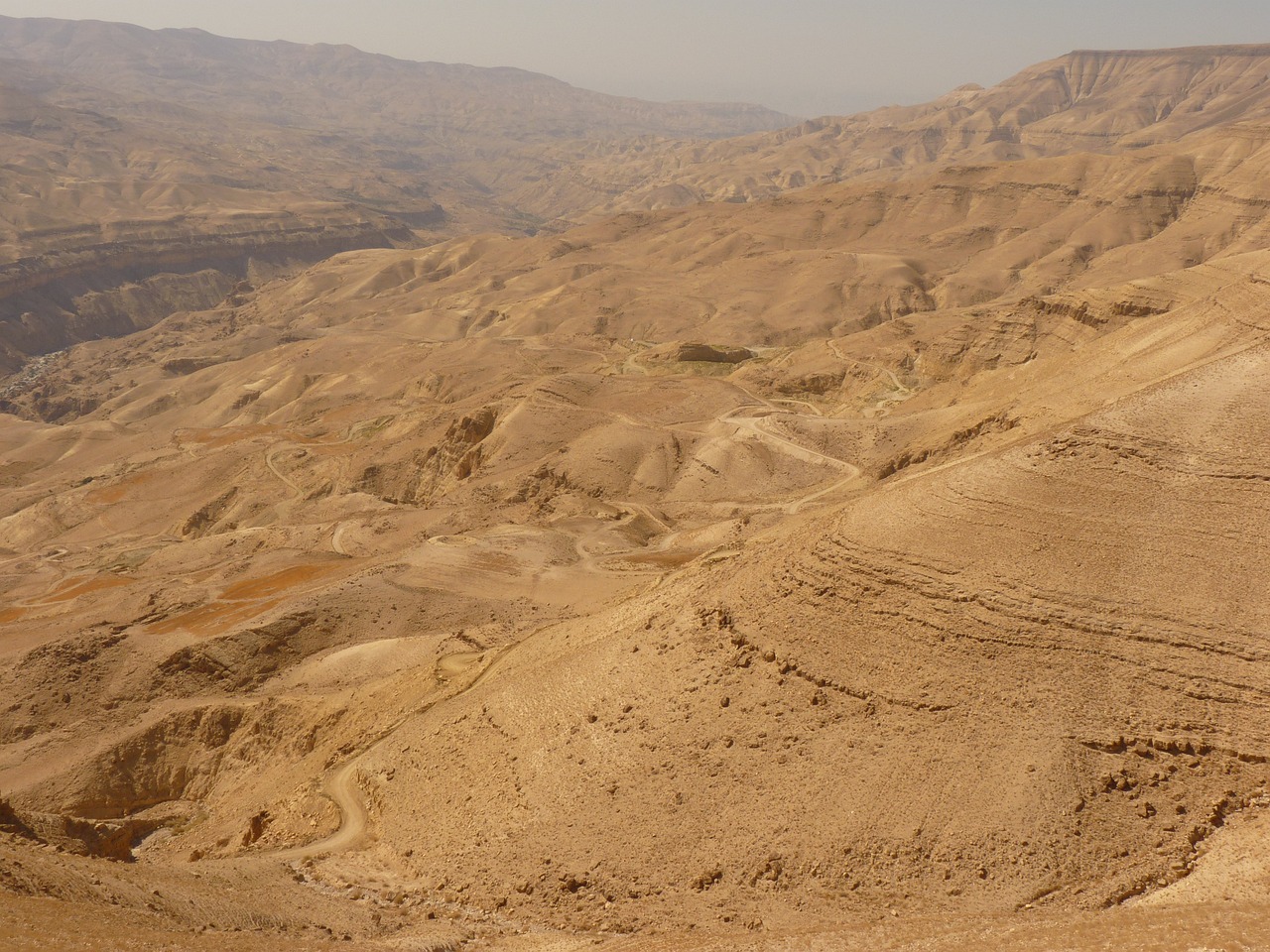 a person riding a horse in the desert, les nabis, expansive view, ancient biblical, benjamin vnuk, downhill landscape