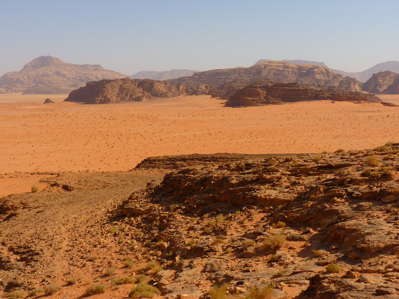 a person riding a horse in the desert, hurufiyya, overlooking martian landscape, red caviar instead of sand, july 2 0 1 1, orange rocks