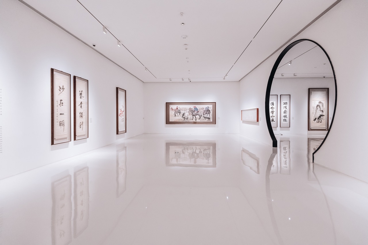 a room with a mirror and paintings on the wall, a minimalist painting, by Weiwei, pexels, visual art, chinese calligraphic painting, very wide angle view, museum lighting, white tile on the floor