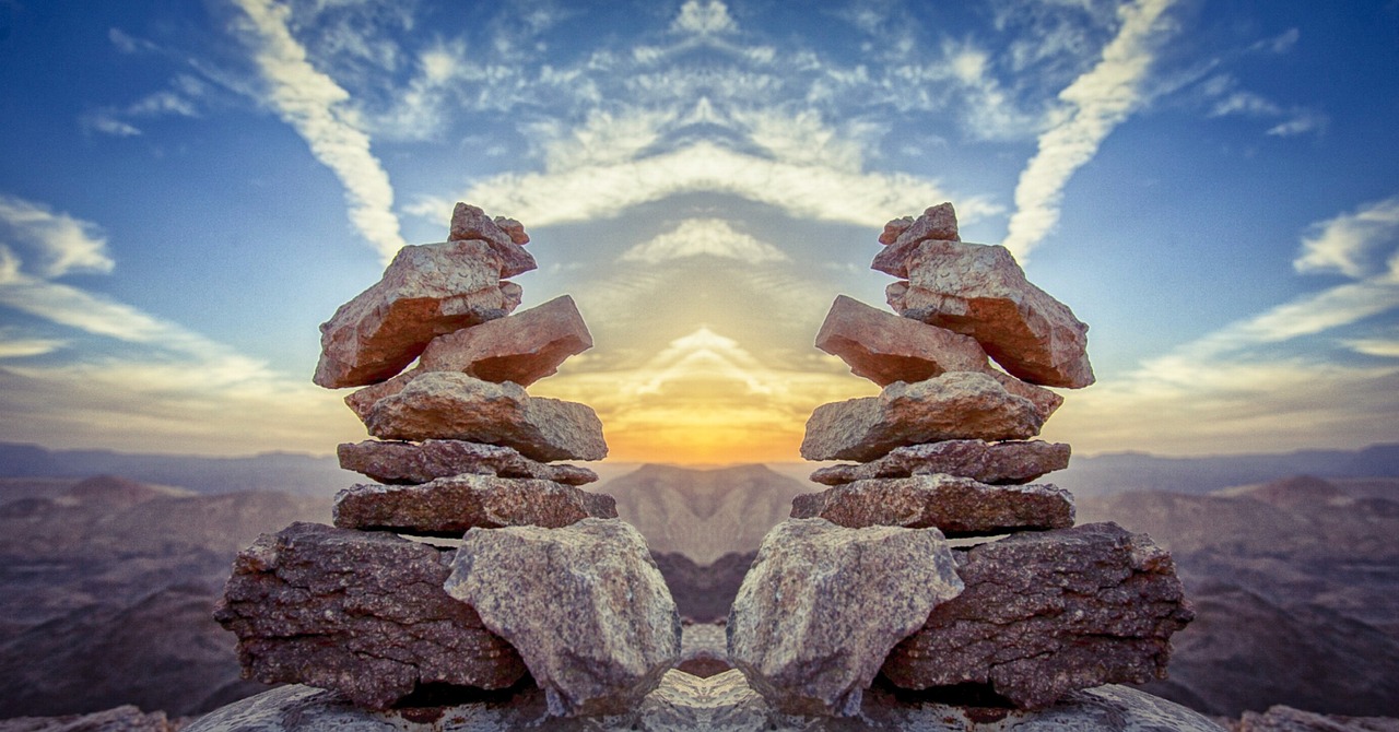 a couple of rocks sitting on top of a mountain, digital art, precisionism, infinite mirrors, totem, enhanced photo, large twin sunset