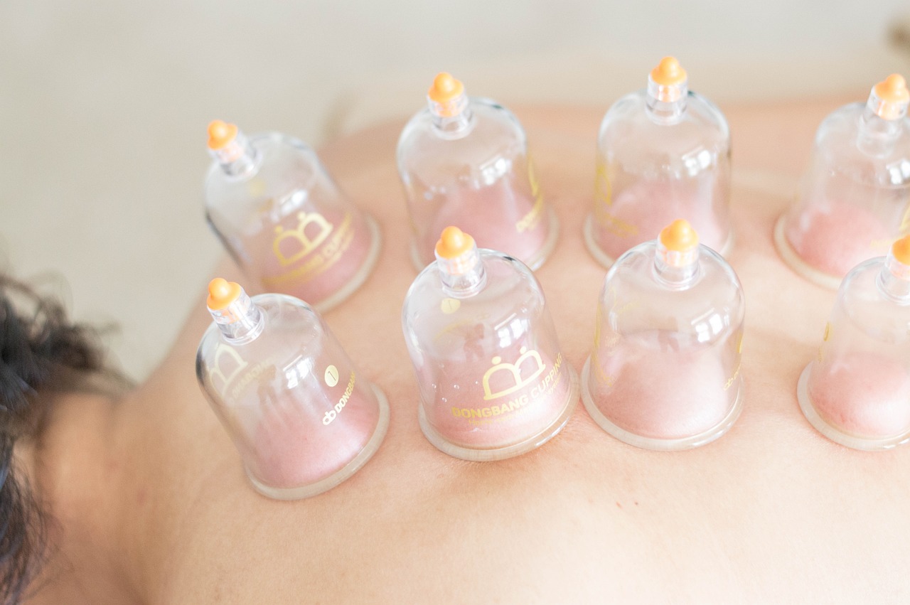 a close up of a person with cuppings on their back, professional product photo, bells, soft opalescent membranes, bo chen