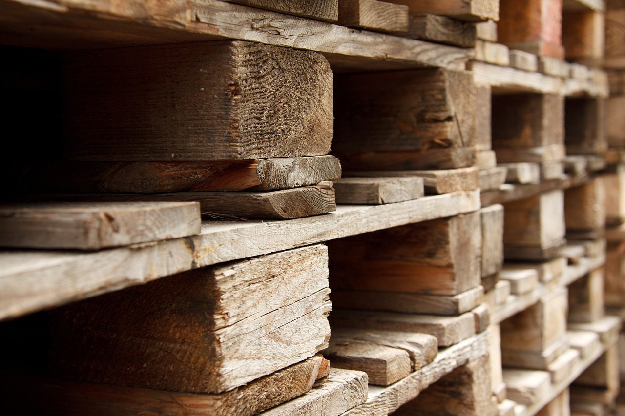 a stack of wooden pallets stacked on top of each other, by Johannes Martini, old wood floors, depth of field”, shelves, holes