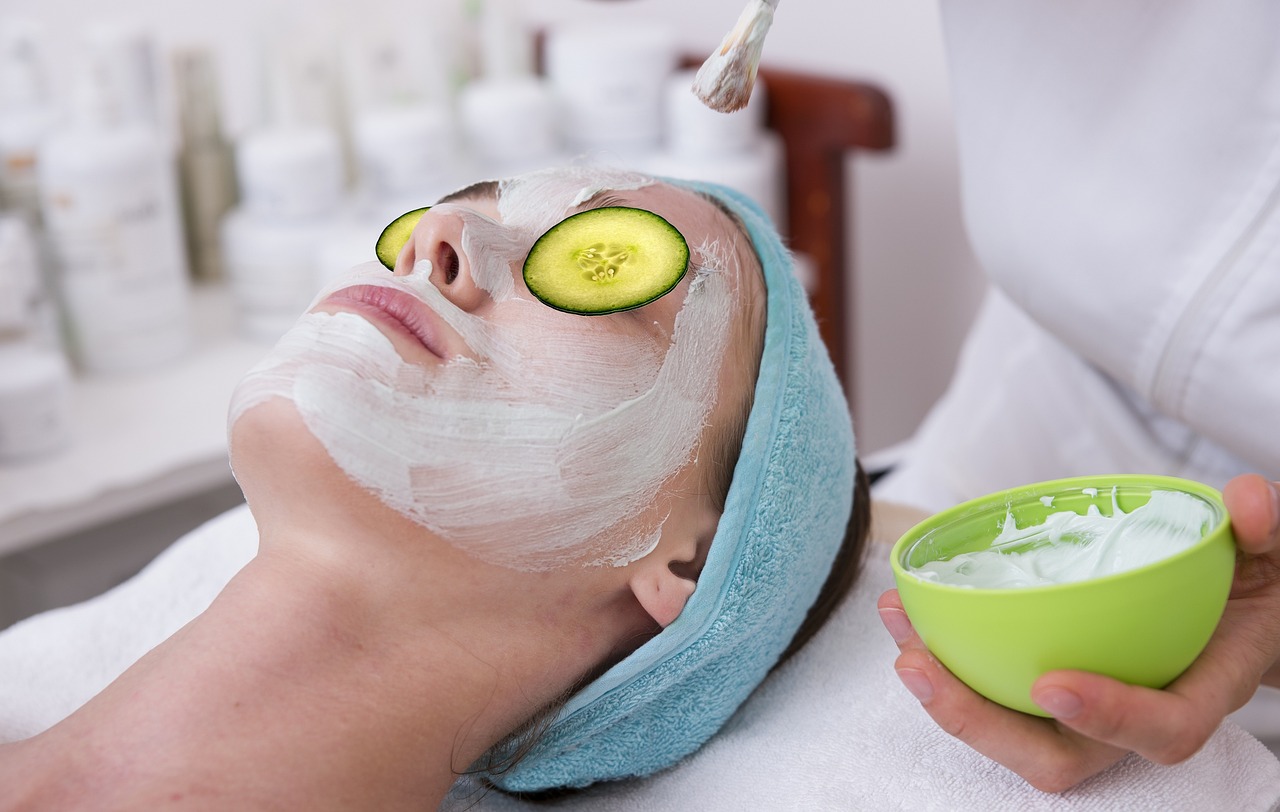 a woman getting a facial mask with cucumber slices on her face, a photo, by Eva Gonzalès, shutterstock, focus on facial - detail!!!!!!, full length shot, manicured, helmet on face