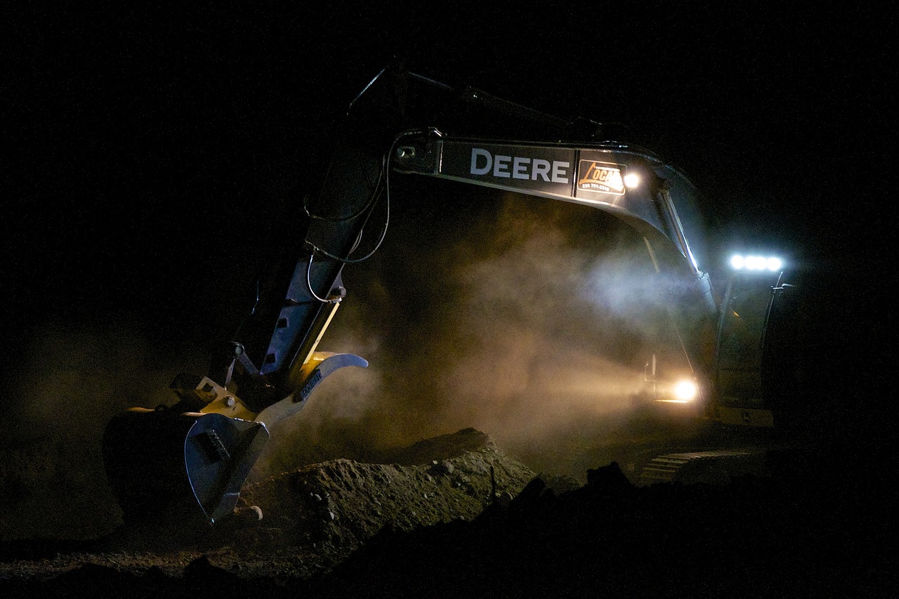 a bulldozer excavating dirt at night, by Joe Stefanelli, pulling the move'derp banshee ', dust light, file photo, advertising photo