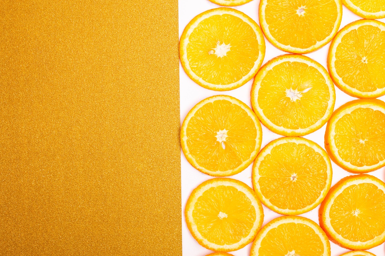 a group of orange slices sitting on top of each other, a stock photo, inspired by Christo, trending on shutterstock, minimalism, accented in bright metallic gold, 🐿🍸🍋, still life photo of a backdrop, on a canva