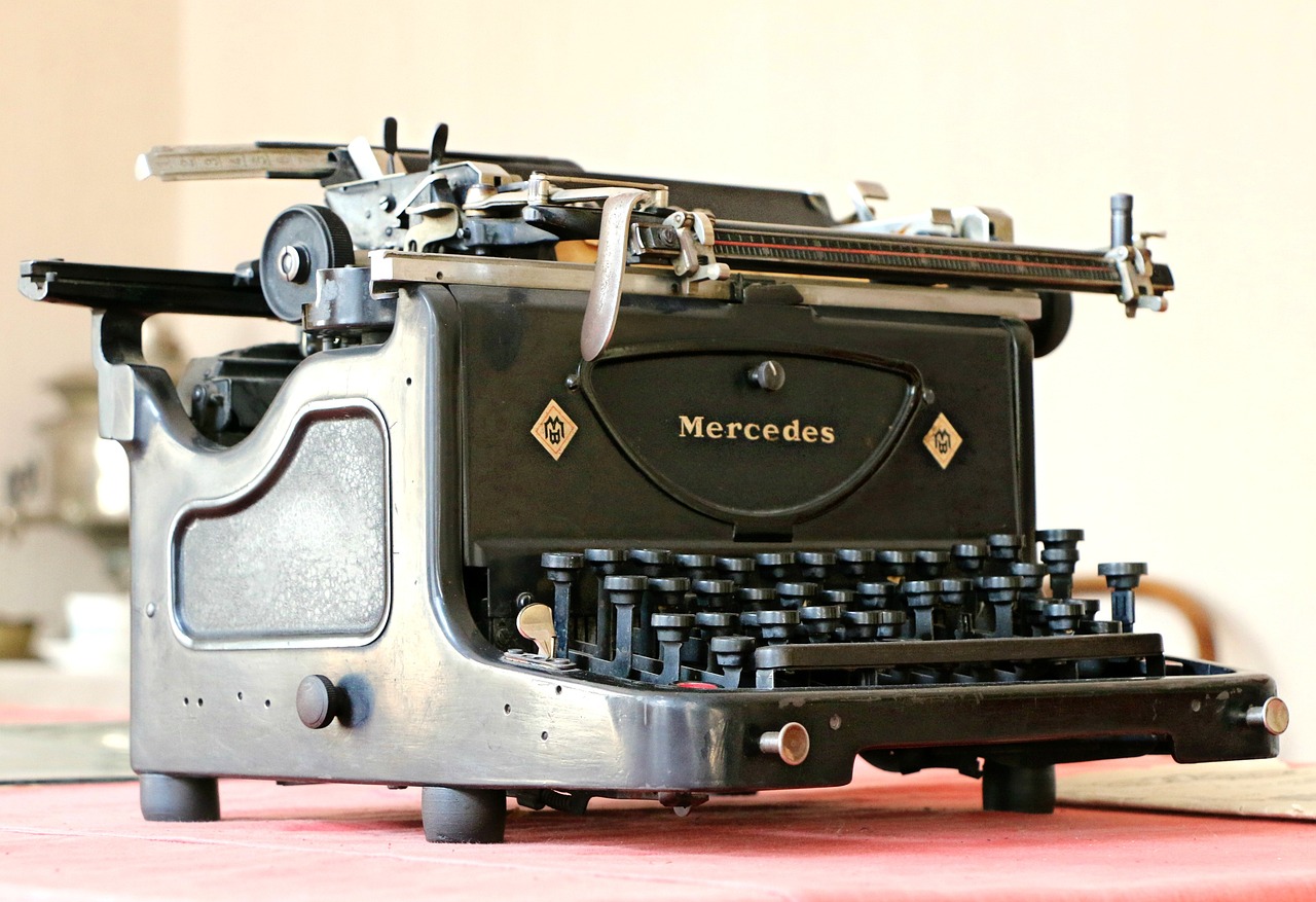 a close up of an old typewriter on a table, by John Murdoch, pexels, modernism, mercedez benz, advert, controller, photo realistic”