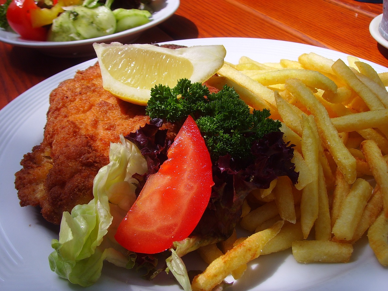 a close up of a plate of food on a table, by Dietmar Damerau, flickr, with fries, new zealand, !!natural beauty!!, chicken