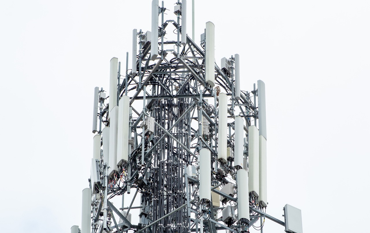 a tower with multiple cell phones on top of it, a portrait, detailed zoom photo, long spikes, high modernization, the background is white