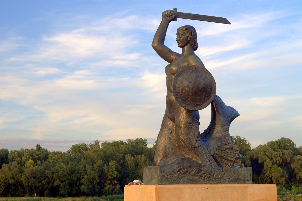 a statue of a woman holding a sword, an art deco sculpture, by György Vastagh, socialist realism, portrait of mermaid warrior, dieselpunk volgograd, full figured mother earth, wikipedia