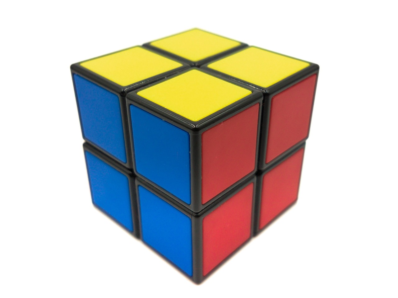 a rubik cube sitting on top of a white surface, a jigsaw puzzle, in black blue gold and red, -w 1024, pvc, high quality”