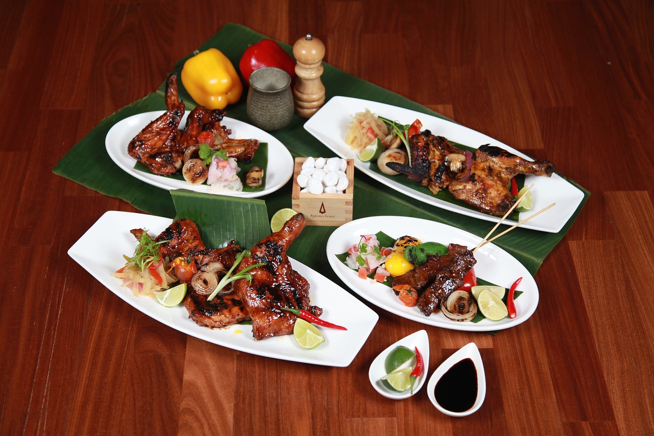 a number of plates of food on a table, four wings, polynesian style, commercial product photography, jakarta