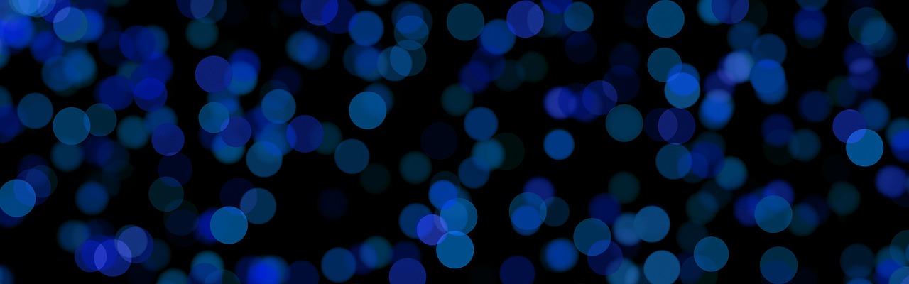 a bunch of blue lights on a black background, a picture, pixabay, digital art, bokeh photo, colorful dots, background image, blue-black