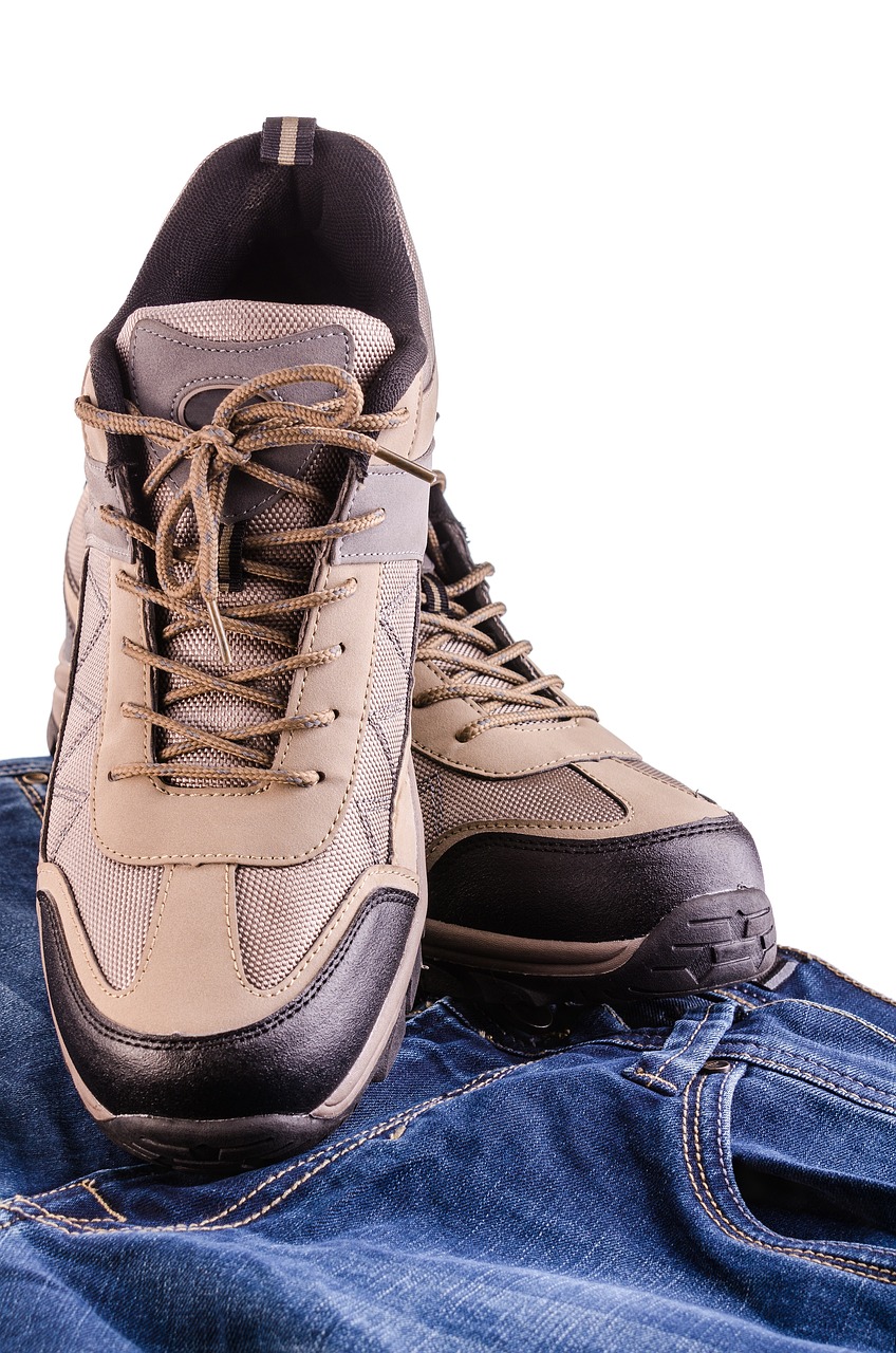 a pair of shoes sitting on top of a pair of jeans, shutterstock, tactical gear, beige, full height view, sneaker photo