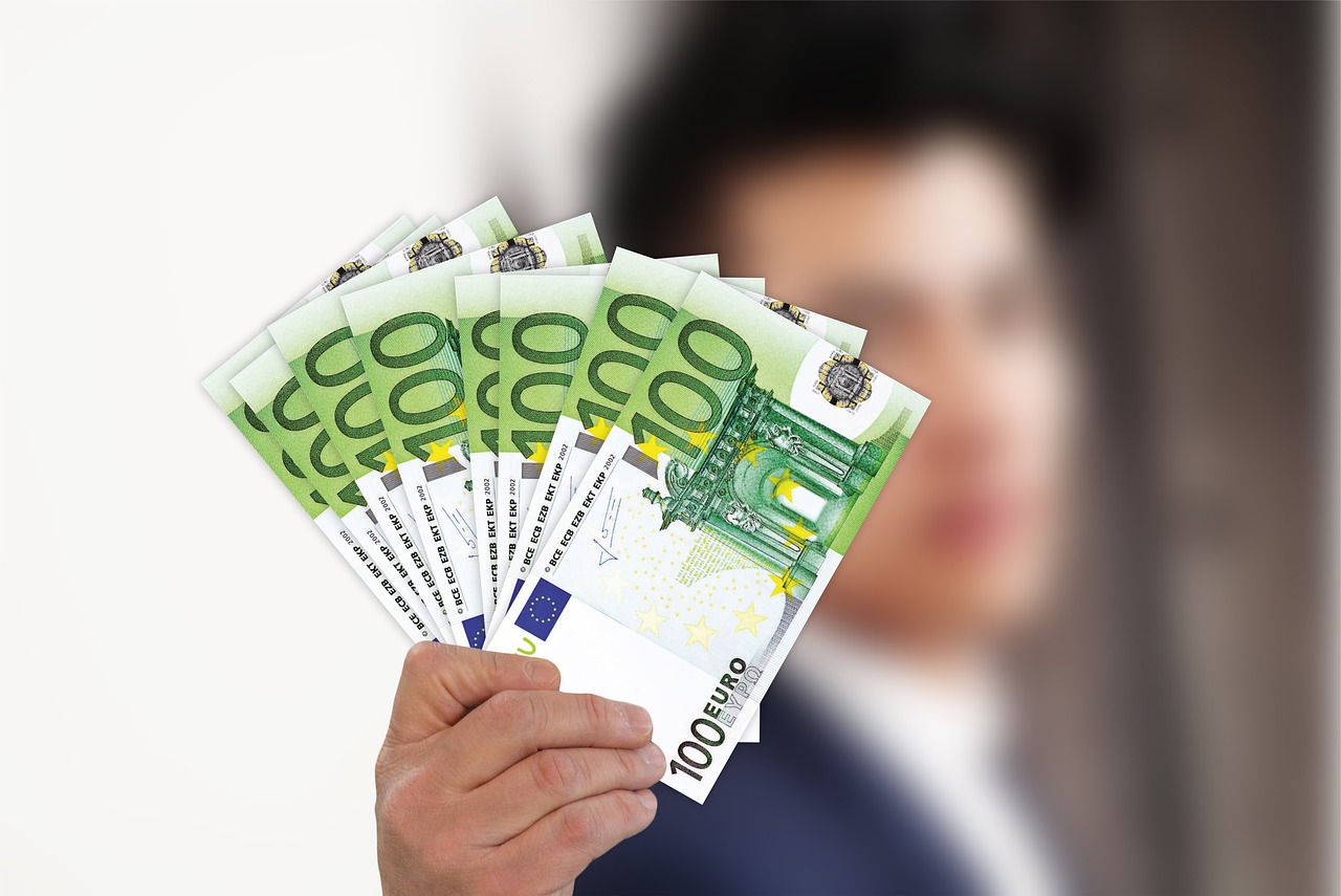 a close up of a person holding a bunch of money, a stock photo, by Jakob Gauermann, pixabay, arbeitsrat für kunst, high quality fantasy stock photo, young man with short, advert, computer generated