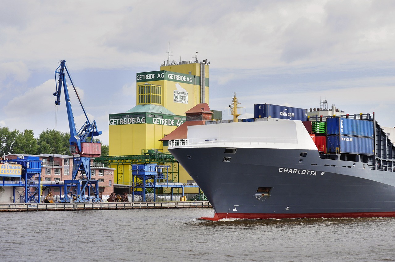 a large boat in a body of water, a portrait, by Werner Gutzeit, shutterstock, bauhaus, shipping docks, a green, giant athanor, warsaw