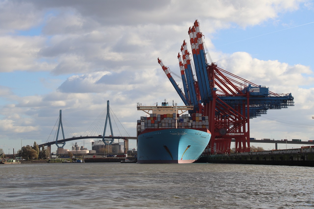 a large ship sitting in the middle of a body of water, a portrait, by Robert Zünd, shutterstock, brown and cyan blue color scheme, brooklyn, crane, stock photo