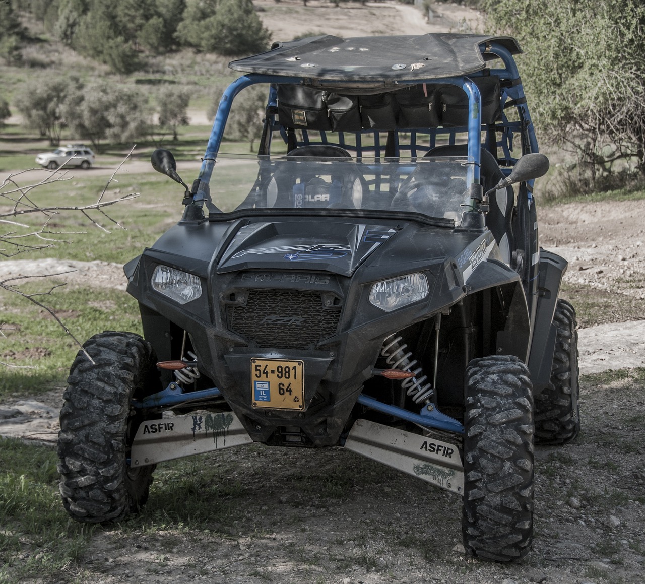 a buggy parked on the side of a dirt road, a portrait, reddit, dau-al-set, highly detailed hdr, fully armored, transparent black windshield, fully body photo