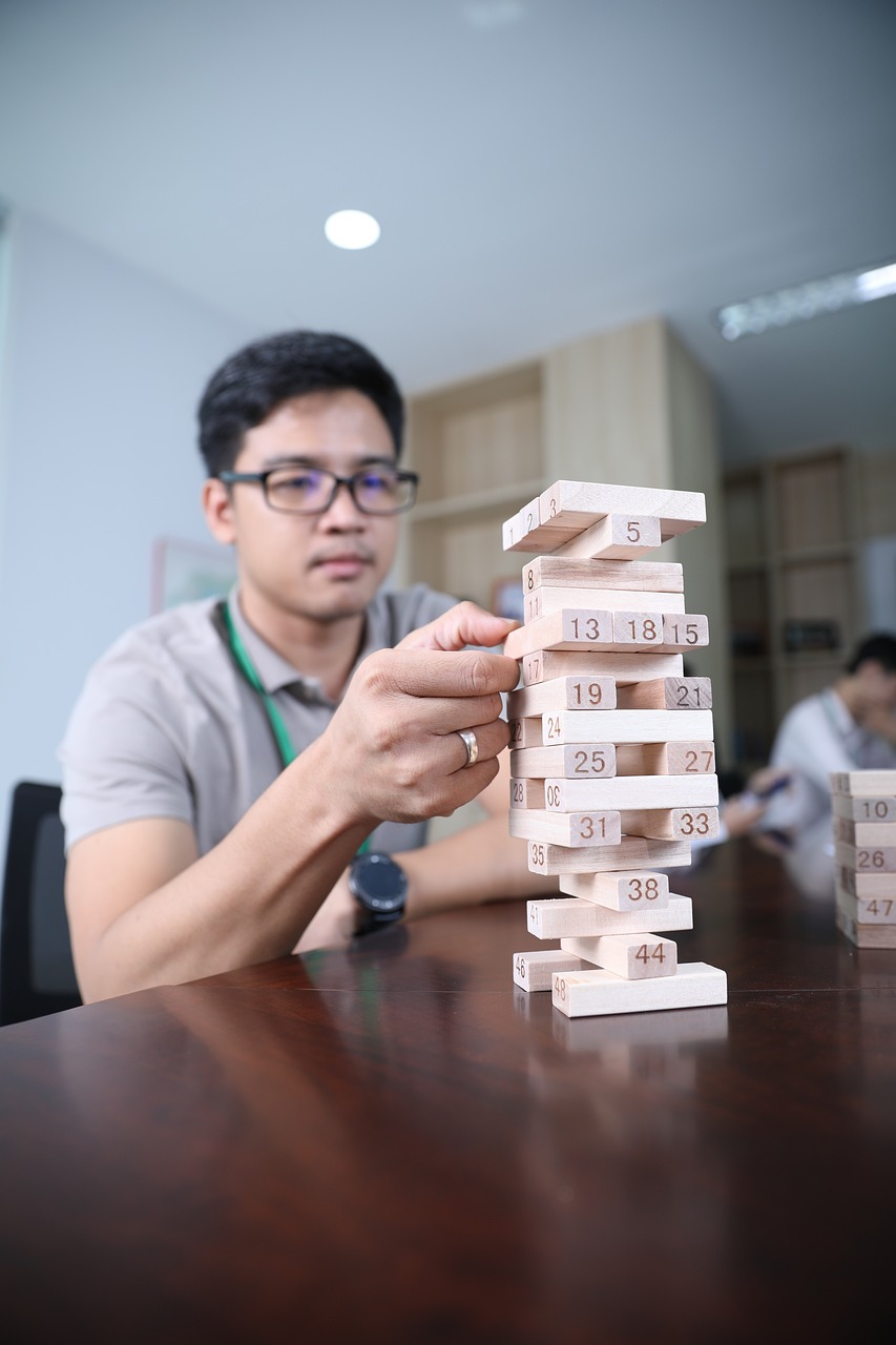 a man playing with wooden blocks on a table, inspired by Cheng Jiasui, for aaa game, product introduction photo, tower, dang my linh