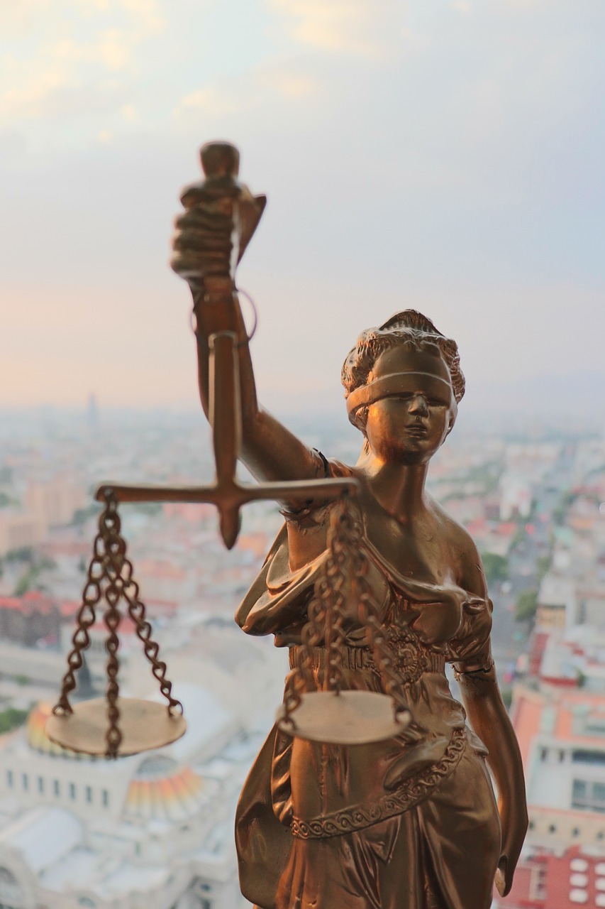 a statue of a lady justice holding a scale, a statue, figuration libre, shot from drone, golden hour closeup photo, looking across the shoulder, high above the ground