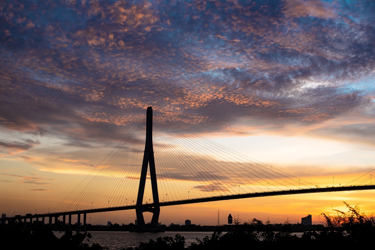 a bridge over a body of water at sunset, by Ceferí Olivé, flickr, taiwan, calcutta, high res photo, panorama