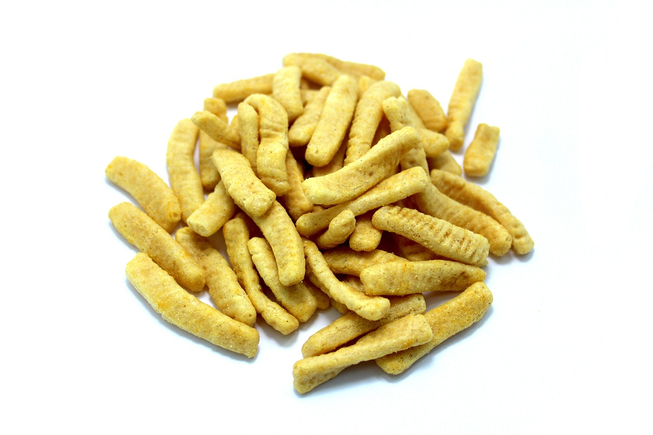 a pile of crackers sitting on top of a white surface, hurufiyya, miniature product photo, nagas, fries, close-up product photo