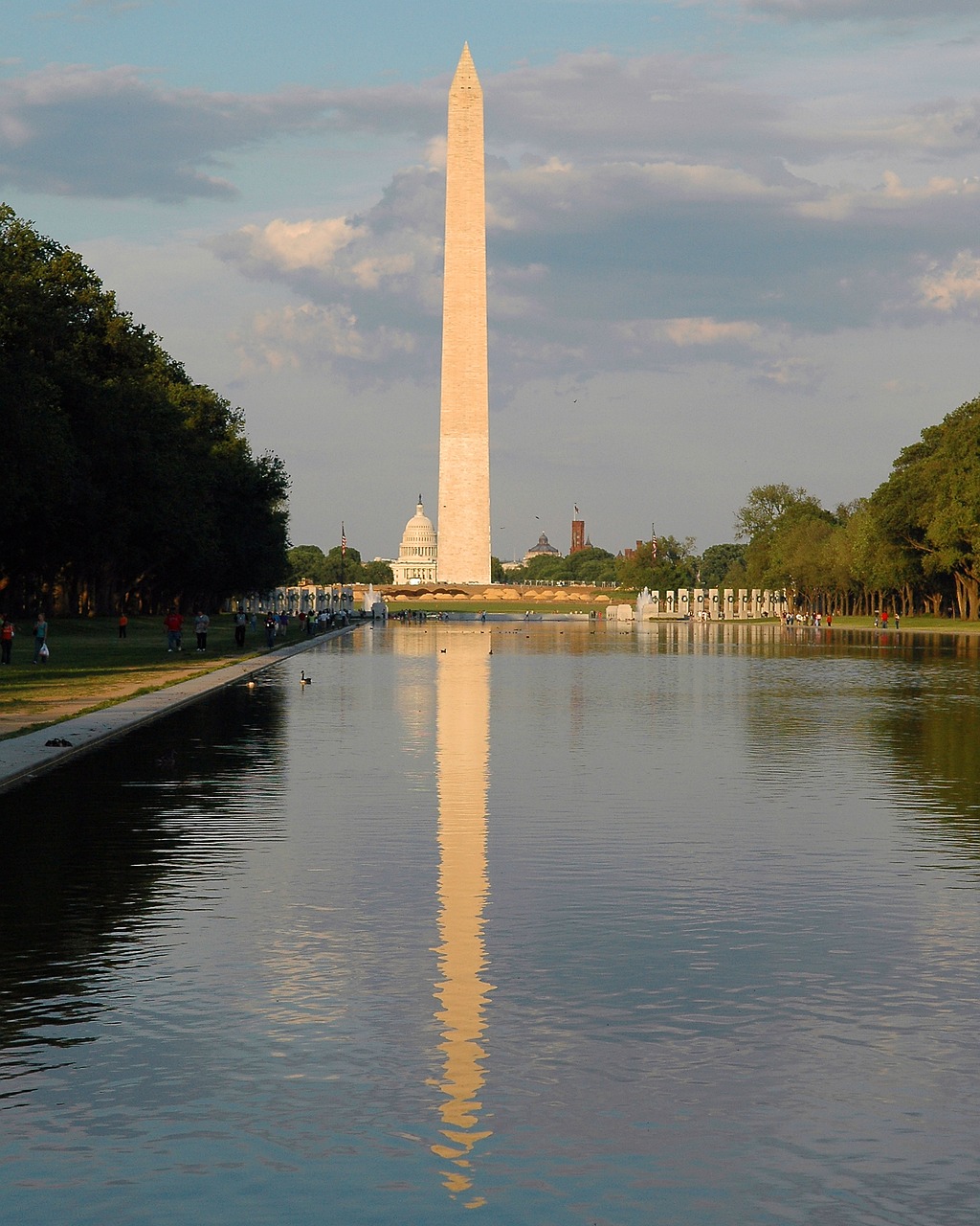 a large body of water with a tower in the background, a photo, by Samuel Washington Weis, flickr, hurufiyya, obelisk, george washington, beautiful reflections, wall of water either side