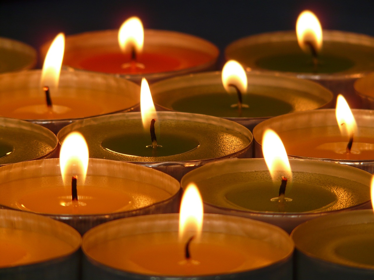 a group of lit candles sitting next to each other, by Emanuel Witz, pexels, digital art, full frame shot, istockphoto, multi colour, close establishing shot