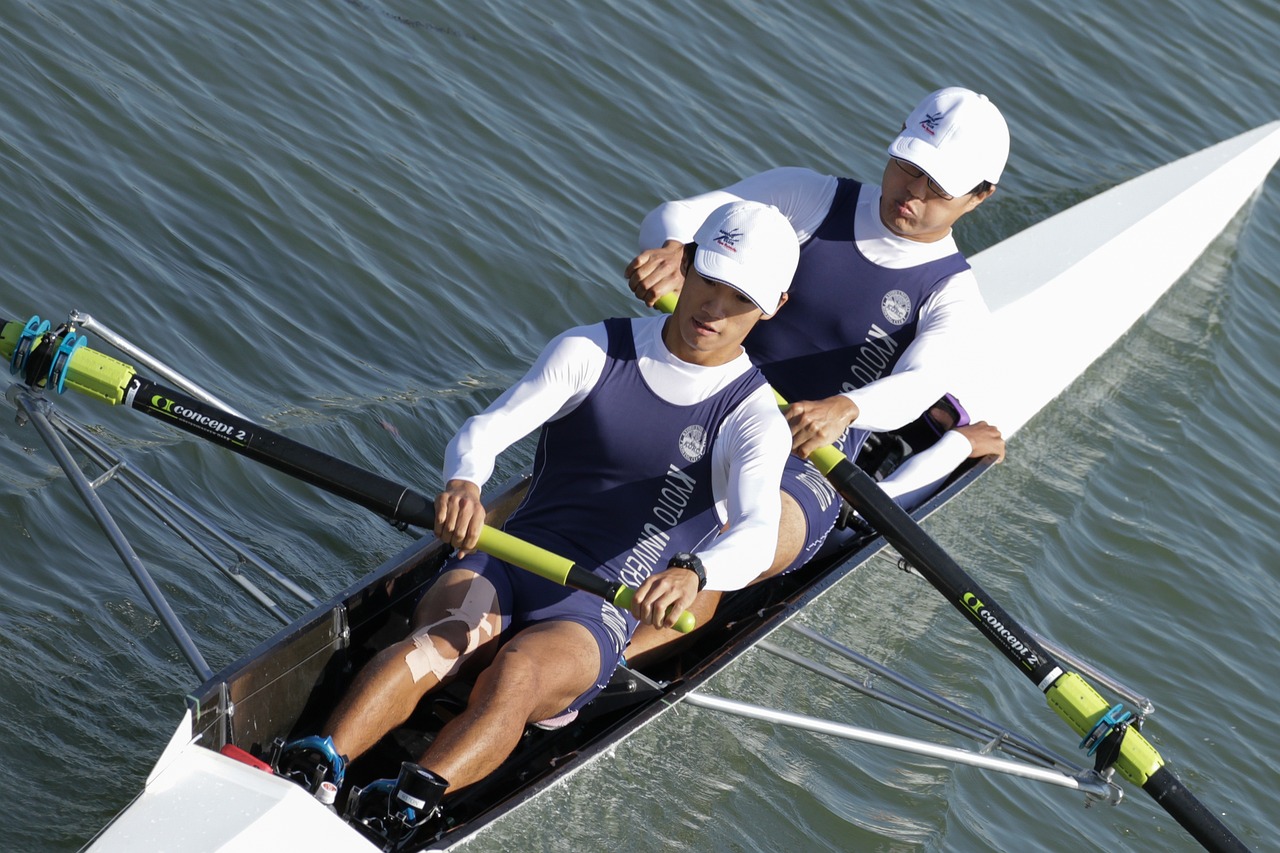 a couple of men riding on top of a boat, shin hanga, sculls, titanium, adidas, 1 female